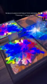 A promotional reel for an interactive dining experience called 7 Paintings, showcasing a 7-course tasting menu where guests interact with art-themed dishes, solve puzzles, and create their own cocktails.