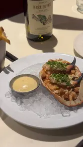 A couple visits Bar Shrimp in Manchester with their 11-month-old baby, showcasing the seafood menu and cocktails in a relatable, family-friendly dining context.