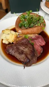 A polished reel showcasing a Sunday roast experience at Mar Hall, a 5-star hotel near Glasgow. The video features shots of the venue's exterior and interior, the menu, and the food, including a unique dessert trolley service.