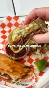A short-form video review of Two Twins Tacos in London, featuring the creator trying various tacos and the birria consommé. The video includes shots of the menu, the exterior, and close-ups of the food, providing a clear and honest assessment of the dining experience.