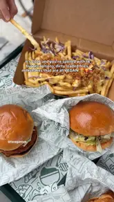 A short, punchy video showcasing a variety of vegan burgers, loaded fries, and milkshakes from a street food venue. The video uses handheld, close-up shots to highlight the textures and presentation of the food.
