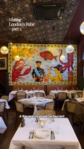 A short-form review of Prince Arthur in Belgravia, highlighting its Basque-inspired menu and intimate, low-lit pub setting. The video features close-ups of various dishes including caviar-topped potatoes, chutoro pintxos, spider crab, halibut, and a large rib steak, alongside shots of the restaurant interior.
