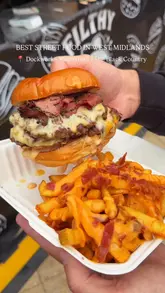 A fast-paced montage showcasing various street food dishes available at Dockworks Waterfront, including burgers, pizza, loaded fries, and desserts.