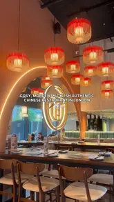 A promotional video for Dan Dan in Battersea, showcasing the restaurant's modern interior and a selection of Chinese dishes including roast duck, sweet and sour chicken, and dim sum.