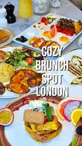 A promotional reel for Double J's, a cafe in London, featuring a variety of brunch and lunch dishes including French toast, a Mediterranean breakfast platter, a mixed grill kebab, and a halloumi wrap. The video uses quick cuts and text overlays to highlight the menu items in a cozy, inviting setting.