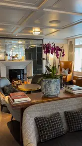 A montage showcasing the interior and food offerings at Lanes of London, located within the London Marriott Hotel Park Lane. The video features a variety of dishes including sliders, salad, fish and chips, and desserts, interspersed with shots of the elegant dining room.