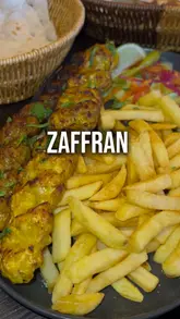 A short, punchy montage showcasing Persian cuisine at Zaffran in Bradford. The video focuses on the preparation of meat skewers over a charcoal grill, followed by shots of hummus and a plated kebab meal with fries and salad.