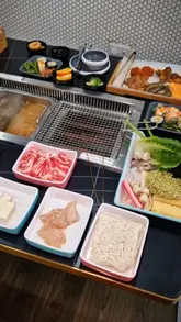 A montage-style video showcasing an all-you-can-eat Korean hotpot and BBQ restaurant, featuring the buffet selection, cooking process, and dining experience.