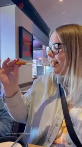 A promotional video for T.G.I. Fridays highlighting a 'kids eat free' offer. The video features shots of the restaurant interior, the menu, various food items, and family-friendly amenities like a photo booth and balloon animals.