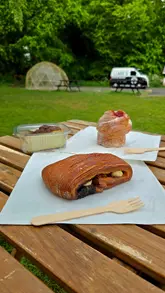 A short video showcasing the pastries and outdoor setting of Liam's Coffee House, featuring close-ups of various baked goods and the coffee van location.