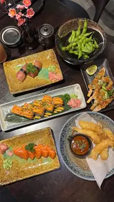 A review of Koku Shi, a Japanese restaurant in Perth, featuring a variety of small plates, sushi, and desserts.