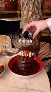 A montage-style video showcasing the interior and various brunch dishes at Apple Butter cafe in London.
