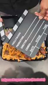 A short video showcasing a takeaway spread from Hollywood Burgers & Shakes, featuring burgers, loaded fries, chicken wings, and milkshakes.