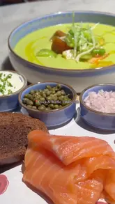 A montage of dishes from the set menu at Duck & Waffle Edinburgh, including risotto, smoked salmon, soup, and desserts like cheesecake and waffles.