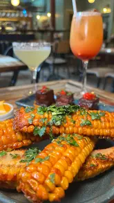 A promotional reel for a Peruvian-Japanese (Nikkei) restaurant in Soho, London, showcasing their tasting menu and cocktails. The video features close-up shots of various dishes, including corn ribs, ceviche, and meat dishes, alongside vibrant cocktails, set to music with text overlays describing the experience.