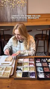 A creator visits Serendipity Crystal Café in London, showcasing the experience of making a custom crystal bracelet while enjoying brunch and dessert. The video highlights the cafe's aesthetic, the bracelet-making process, and the food offerings.