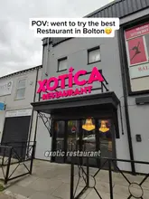 A POV-style video showcasing a visit to Xotica Restaurant in Bolton, featuring the interior decor, the ordering process, and a variety of dishes including steak and pasta.