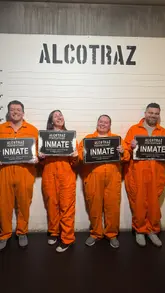 A group of friends visits Alcotraz, an immersive prison-themed bar experience. The video follows their journey from arrival to being processed, donning orange jumpsuits, and enjoying cocktails inside a prison cell.