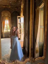 A high-quality, polished mirror selfie taken in a luxurious, historic room at Cliveden House, capturing an elegant aesthetic suitable for celebrations.