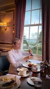 A polished, aesthetic montage showcasing a family stay at Ansty Hall, highlighting the landscaped gardens, afternoon tea, bar drinks, and dining experience.