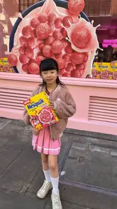 A short, energetic reel showcasing a pink-themed Nesquik pop-up cafe in London. The video features a young girl exploring the space, eating the strawberry-flavoured cereal, and posing with the product, highlighting the fun, aesthetic nature of the limited-time event.