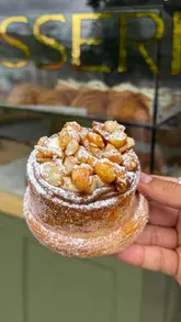 The video is a listicle-style review featuring three food spots in Liverpool: Suburbs, Derek's, and Press Bros. The creator visits each location, showcasing specific menu items like croissant breakfast sandwiches, New York-style subs, and loaded hash browns, providing brief commentary and taste tests for each.