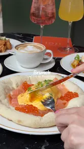 A montage of food and interior shots at Tozi in Battersea, featuring brunch dishes like pizzettas and burrata, alongside cocktails and coffee.