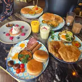 I've found you the perfect new breakfast and brunch spot in Manchester's city centre 🙌🏻
.
.
Sangam, the Indian restaurant you all know and love are now serving up delicious breakfast and brunch dishes daily from 9am to 11:45am 🙌🏻
.
.
I visited this week and I was truly impressed 😍
.
.
WHAT WE ORDERED:
- Pelwan's Ka Nasta 🥓 (Sausages, turkey rashers, masala beans, grilled mushrooms, tomatoes and a homemade bun - fried eggs added)
- Keema & Kouliza 🍳 (Keema Indian nasta with chicken liver, fried egg, salli crisp chips and home-made puri)
- Chola Puri Ka Halwa 🍛 (Chickpea curry served with homemade puff puris, sweet semolina and pickles)
- Omelette Paratha with Halwa Puri 🌯 (Chilli omelette wrapped in flaky paratha and served with halwa puri)
- Bombay Pancakes 🥞
- Mango Lassi 🥭
- Breakfast Lassi 🍌
- Masala Chai ☕️
.
.
Wow, I absolutely loved this! Each dish tasted incredible and the presentation was stunning! Packed full of flavour - there wasn't a single item I didn't like! 👏🏻
.
.
My favourites were the masala beans in my breakfast, the pancakes were to die for - I've never had pancakes that melted in my mouth like that - stunning! Also, the best mango lassi I've had in so long. Everything was incredible 🤩🤩
.
.
It was my first time at Sangam and I loved it! Unreal brunch, great service, stunning interior and fab vibes 🙌🏻 So good to speak to the owners too and find out about the history of the restaurant ✨️
.
.
As well as breakfast/brunch and their incredible menu of Indian food, they're also now doing Afternoon Tea and they have a seperate terrace area which is going to be perfect for the Summer ☀️ It's all happening in Sangam so be sure to check them out - https://sangam.co.uk/
.
.
📍Sangam - Manchester City Centre, Portland St @sangamrestaurants
✉️ Invite (Thank you so much for having us ✨️)
.
.
#manchester #indianfood #brunch #breakfast #restaurant Which dish are you choosing?