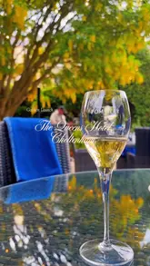 A montage video showcasing the summer garden launch at The Queens Hotel in Cheltenham. The video features shots of the hotel exterior, the outdoor terrace, live music, champagne, and various food dishes, creating an elegant and inviting atmosphere.