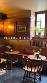 A short, aesthetic montage showcasing the interior and food offerings of The Birnam Inn, highlighting its cozy atmosphere, fireplace, and pub-style menu.