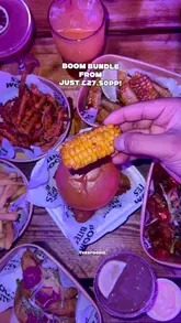 A fast-paced, energetic promotional video for Boom Battle Bar, highlighting the 'Boom Bundle' offer. The reel features quick cuts of various activities like axe throwing, crazy golf, beer pong, and pool, interspersed with shots of burgers, fries, and cocktails. It effectively communicates the venue's fun, social atmosphere and value proposition for group outings.