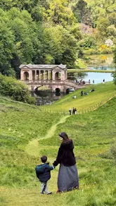 A travel-focused video showcasing the scenic beauty of Prior Park and Alexandra Park in Bath, featuring the iconic Palladian bridge and panoramic city views.