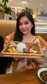 A review of a Filipino restaurant in London, showcasing their affordable 3-course meal deal served on a traditional bamboo tray and highlighting the authentic, communal dining experience.