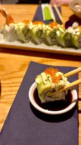A short video showcasing a visit to Yakitori 1 in Cardiff Bay, featuring shots of the exterior, interior, and various Japanese dishes like yaki soba, katsu curry, and sushi.