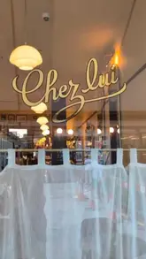 A montage showcasing the interior, menu, and various French dishes at Chez Lui in Notting Hill, set to music.