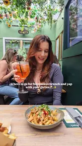 A promotional reel for a bottomless brunch at The Lawn Club in Manchester, featuring shots of the venue's floral decor, the food menu, cocktails, and the lively atmosphere with guests dancing.