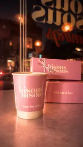 A polished, aesthetic montage showcasing a French-inspired tasting menu at a cafe venue. The video features close-up shots of various courses, including focaccia, croquettes, poached egg, lamb, and dessert, interspersed with brief glimpses of the interior atmosphere.