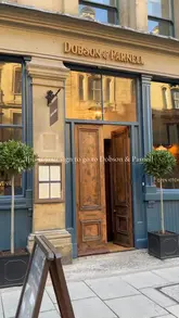 A montage-style video showcasing the interior, exterior, and various dishes at Dobson & Parnell in Newcastle. The video features close-up shots of oysters, meat dishes, and desserts, set to upbeat music.
