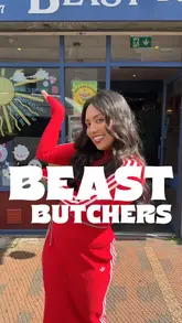 A creator visits a local butcher shop, Beast Butchers, to highlight their high-quality, free-range, and organic meat products. She interviews the butcher and explains how she incorporates specific cuts like pork, short rib, and beef fillet into her signature dishes.