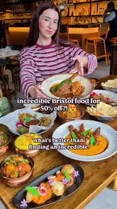 A promotional video featuring a creator reviewing Nutmeg Street Kitchen in Bristol, highlighting a 50% discount offer available through the First Table app. The video showcases various Indian dishes and the restaurant's interior.