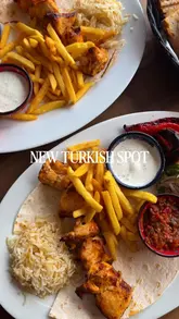 A montage-style promotional video for River Kitchen, showcasing their Turkish cuisine, including a hot mezze platter, chicken shish kebab, and baklava, alongside the venue's interior and waterside setting.