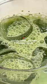 A short, aesthetic video showcasing a Vietnamese specialty coffee shop in London, featuring close-ups of iced coffee, matcha, and a cookie, alongside shots of the venue's interior and exterior.