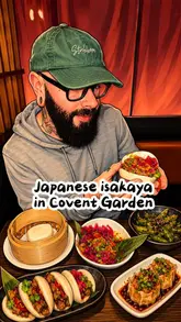 The creator visits the Flesh & Buns restaurant in Covent Garden, providing a review of their experience. They showcase various dishes including cocktails, wagyu, soft shell crab, yakitori, tempura vegetables, Korean wings, bao buns, and dessert, while sharing their thoughts on the food and service.