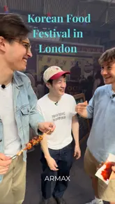 A group of creators visits a Korean food festival in London, sampling various street food items like skewers and pancakes. The video captures the lively atmosphere of the market, the cooking process, and their reactions to the food.