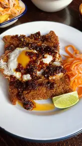 The creator visits three London venues—Barang, Mamapen, and The Red Cow—to review their Cambodian food offerings. The video features a mix of close-up food shots, venue interiors, and the creator's personal commentary on the dishes, providing a helpful guide for viewers looking to try Cambodian cuisine in the city.