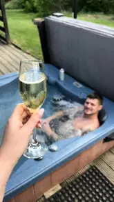 A travel vlog documenting a birthday weekend trip to the New Forest, featuring a stay at a lodge with a hot tub and an afternoon tea experience that includes a dog-friendly menu.