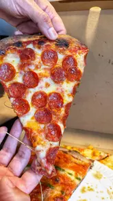 A short, punchy video showcasing four different pizza slices from Sears Pizza. The creator holds each slice up to the camera to display the crust, toppings, and cheese, then dips each one into a sauce, providing a brief description of the flavors and ingredients for each.