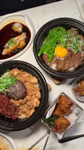 A short, visually appealing reel showcasing a variety of dishes at Pot and Rice, including claypot rice, chicken karaage, prawn cheung fun, and fried oysters. The video uses close-up shots to highlight textures and the preparation process, effectively presenting the food in an inviting manner.