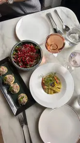 A short, aesthetic montage featuring various small plates, cocktails, and desserts at Leicester Square Kitchen. The video highlights the presentation of the food and the stylish interior of the restaurant.