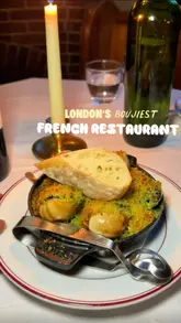 A food review video showcasing a French restaurant called Bistro Sablé in Islington, featuring dishes like snails, croque madame, beef bourguignon, steak, and chocolate mousse.